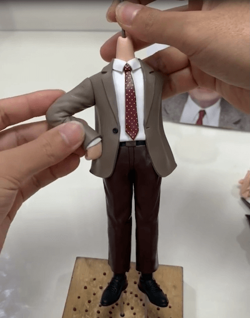 Connect his arm of the bobblehead